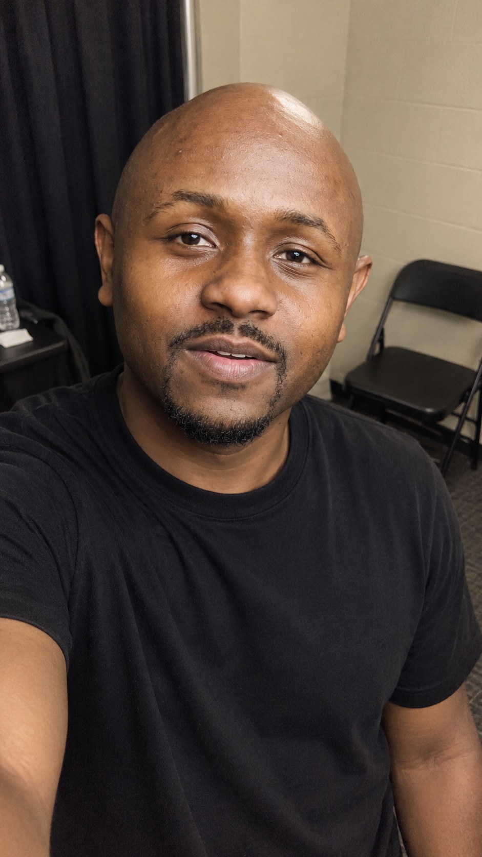 Ryan Perez, selfie in a black t-shirt